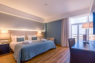 a room with a bed and a desk