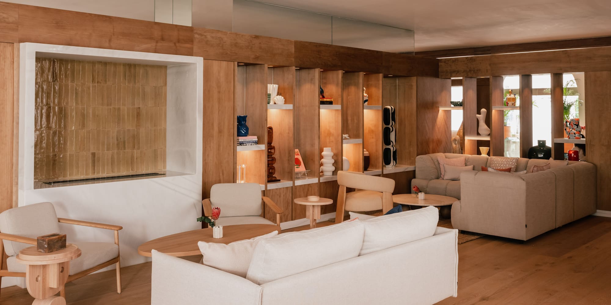 a room with a couch and chairs