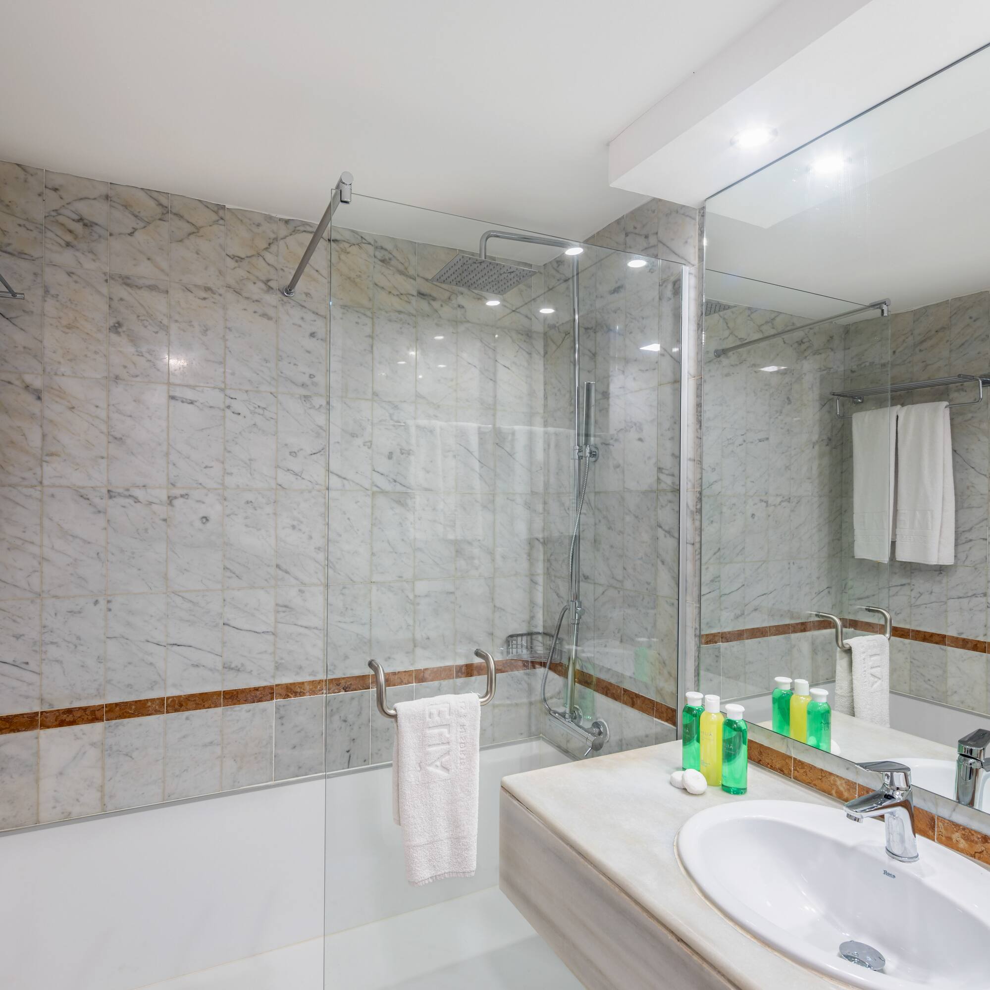 a bathroom with marble tiles