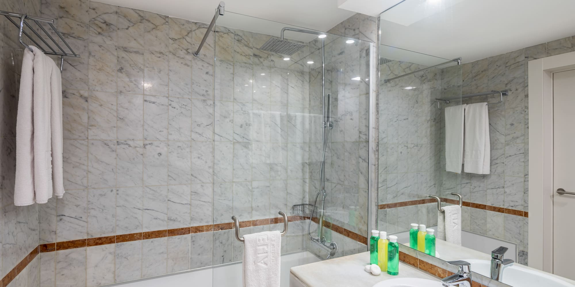 a bathroom with marble tiles