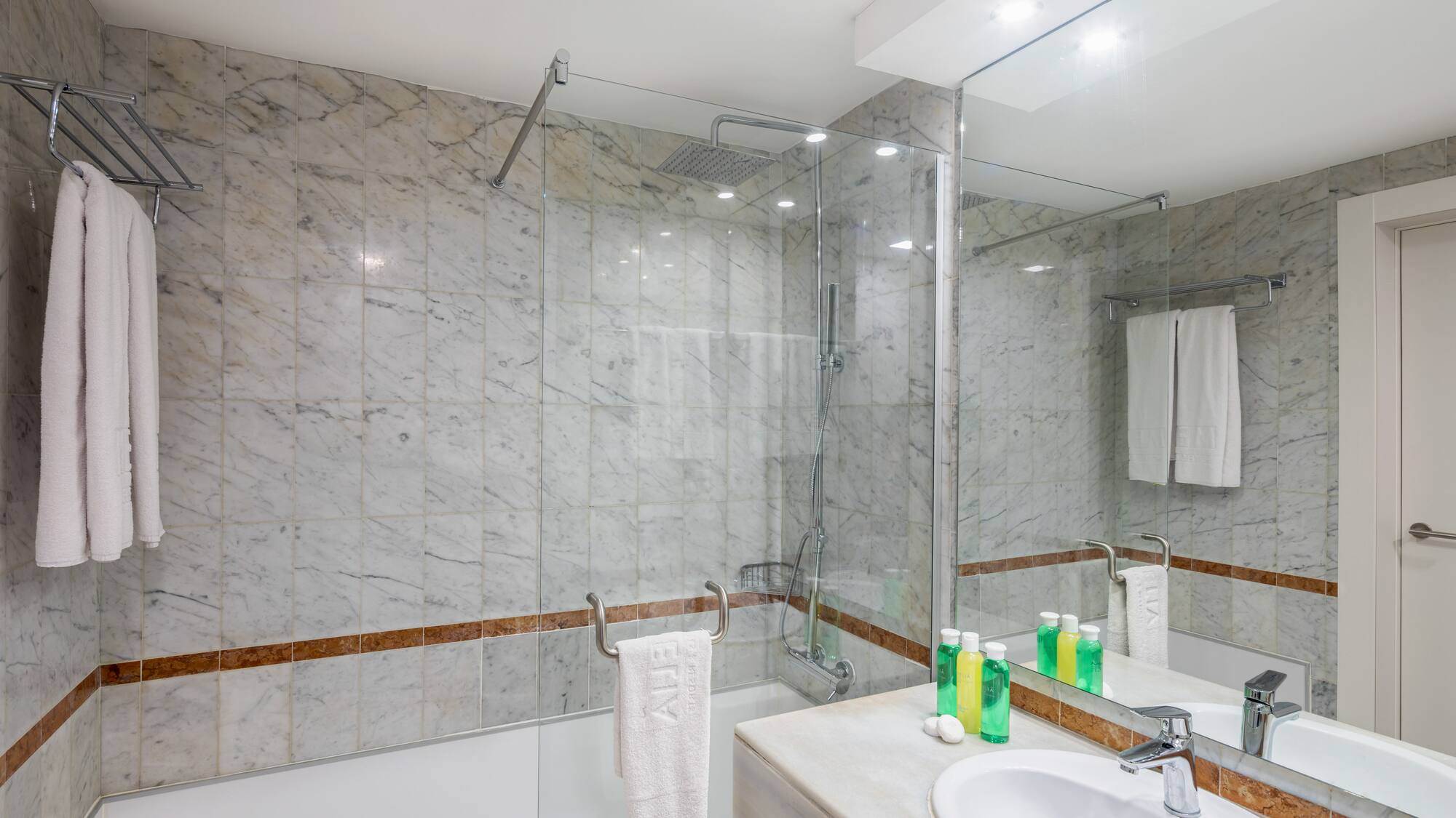 a bathroom with marble tiles