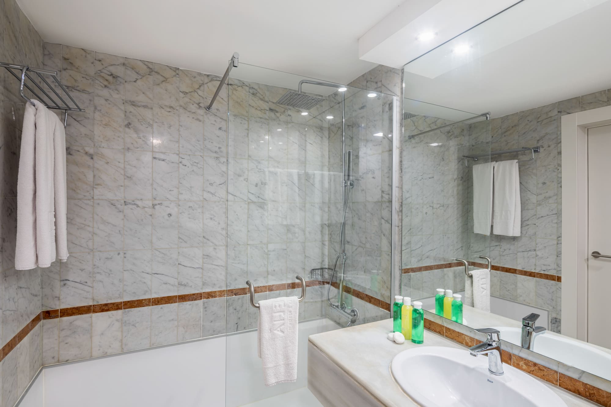 a bathroom with marble tiles