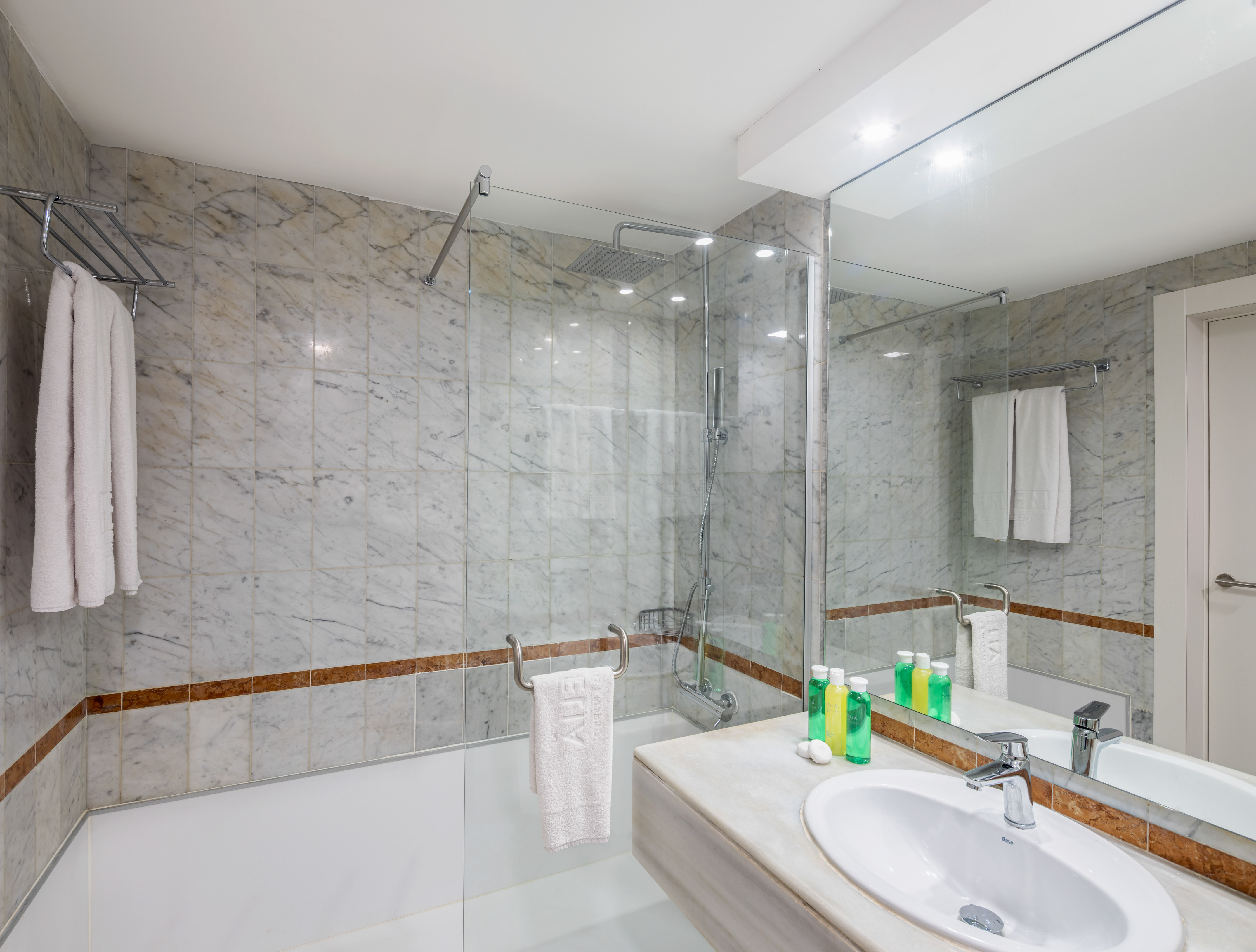 a bathroom with marble tiles