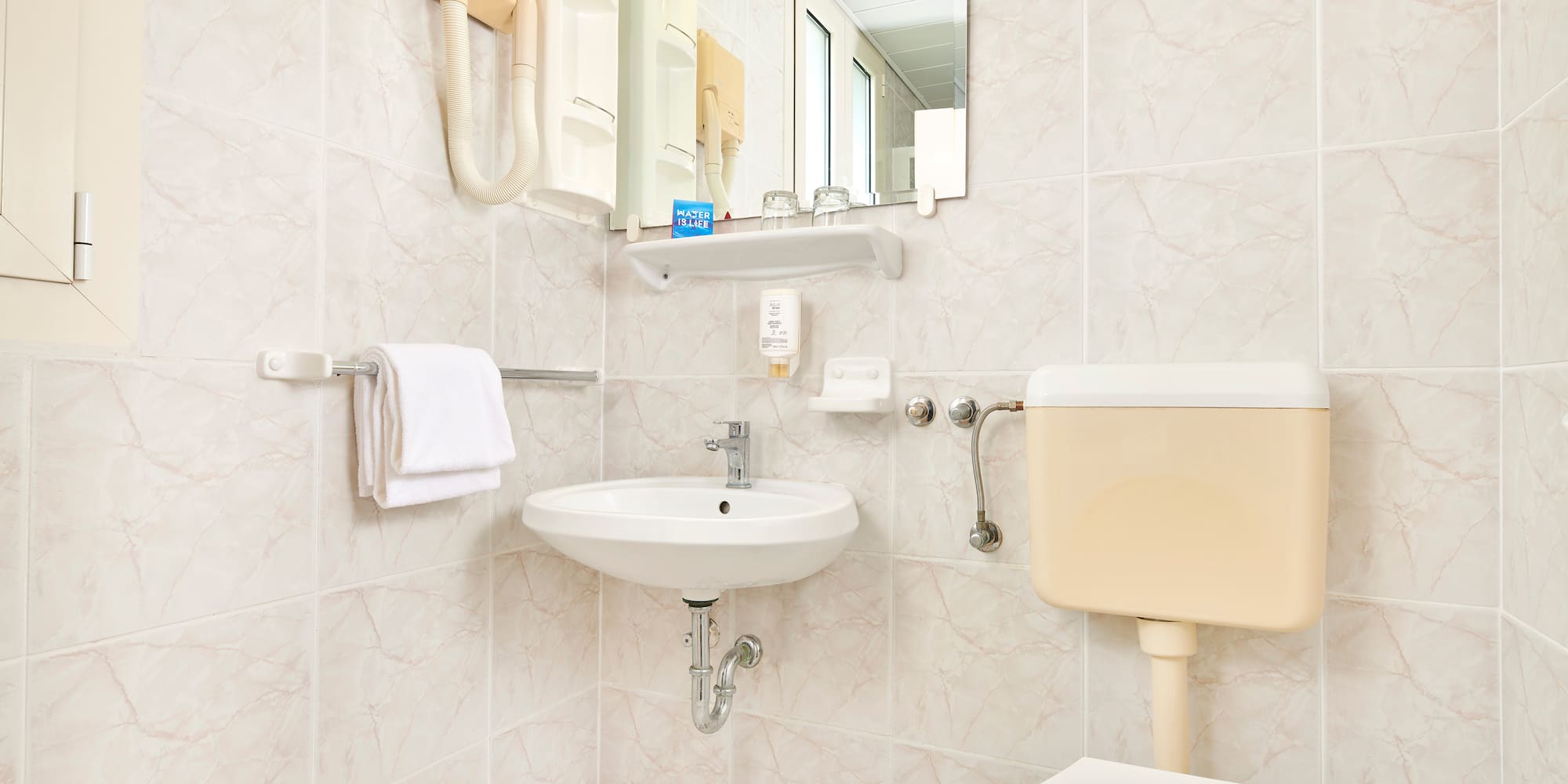 a bathroom with a sink and toilet