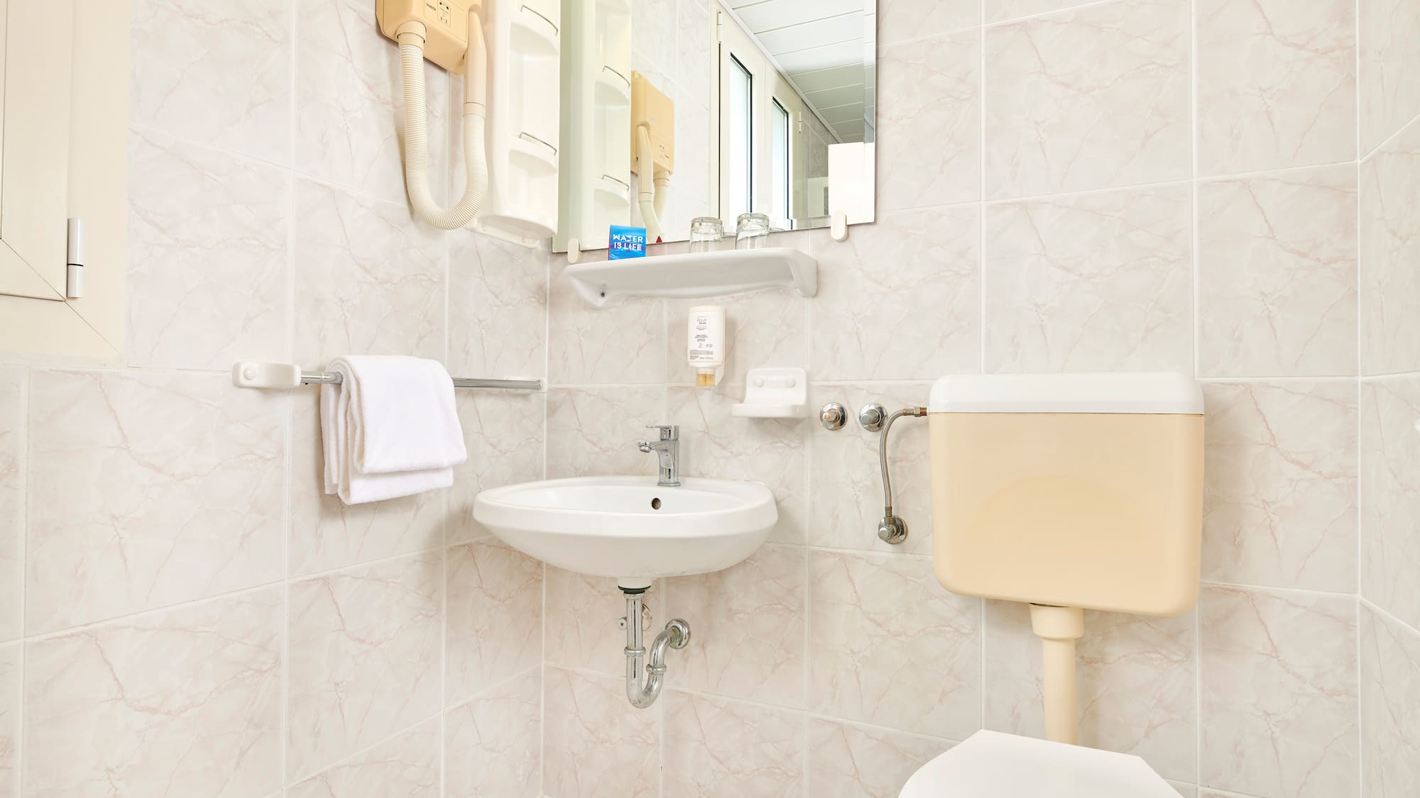 a bathroom with a sink and toilet
