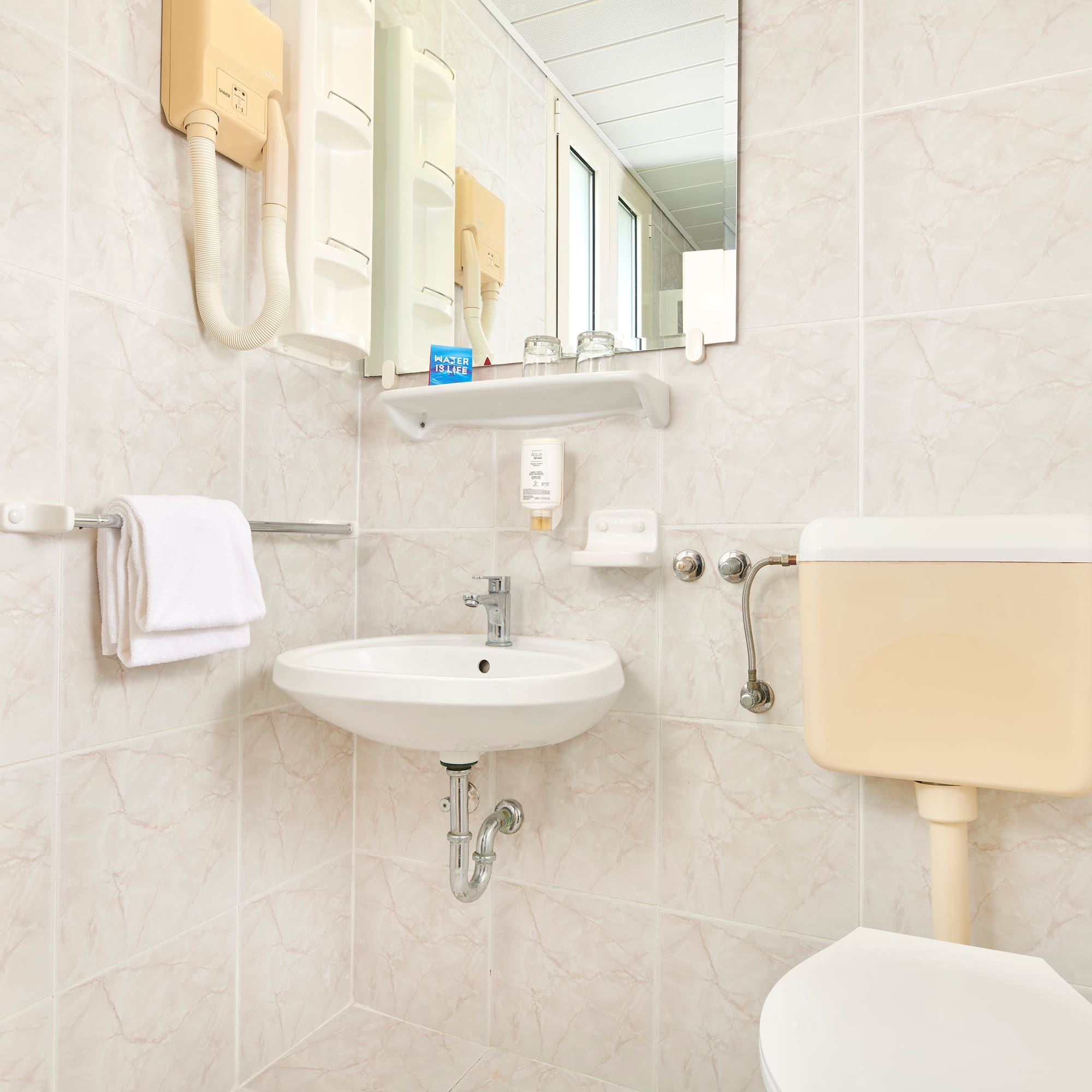 a bathroom with a sink and toilet