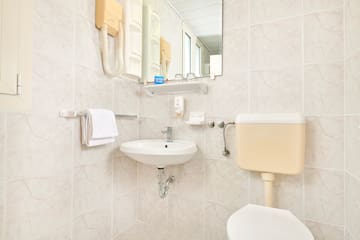 a bathroom with a sink and toilet