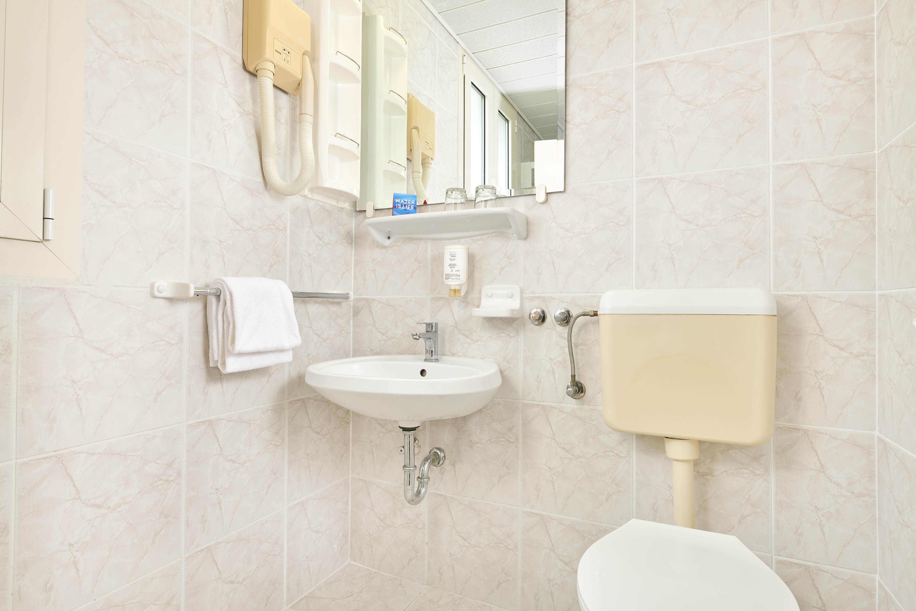 a bathroom with a sink and toilet