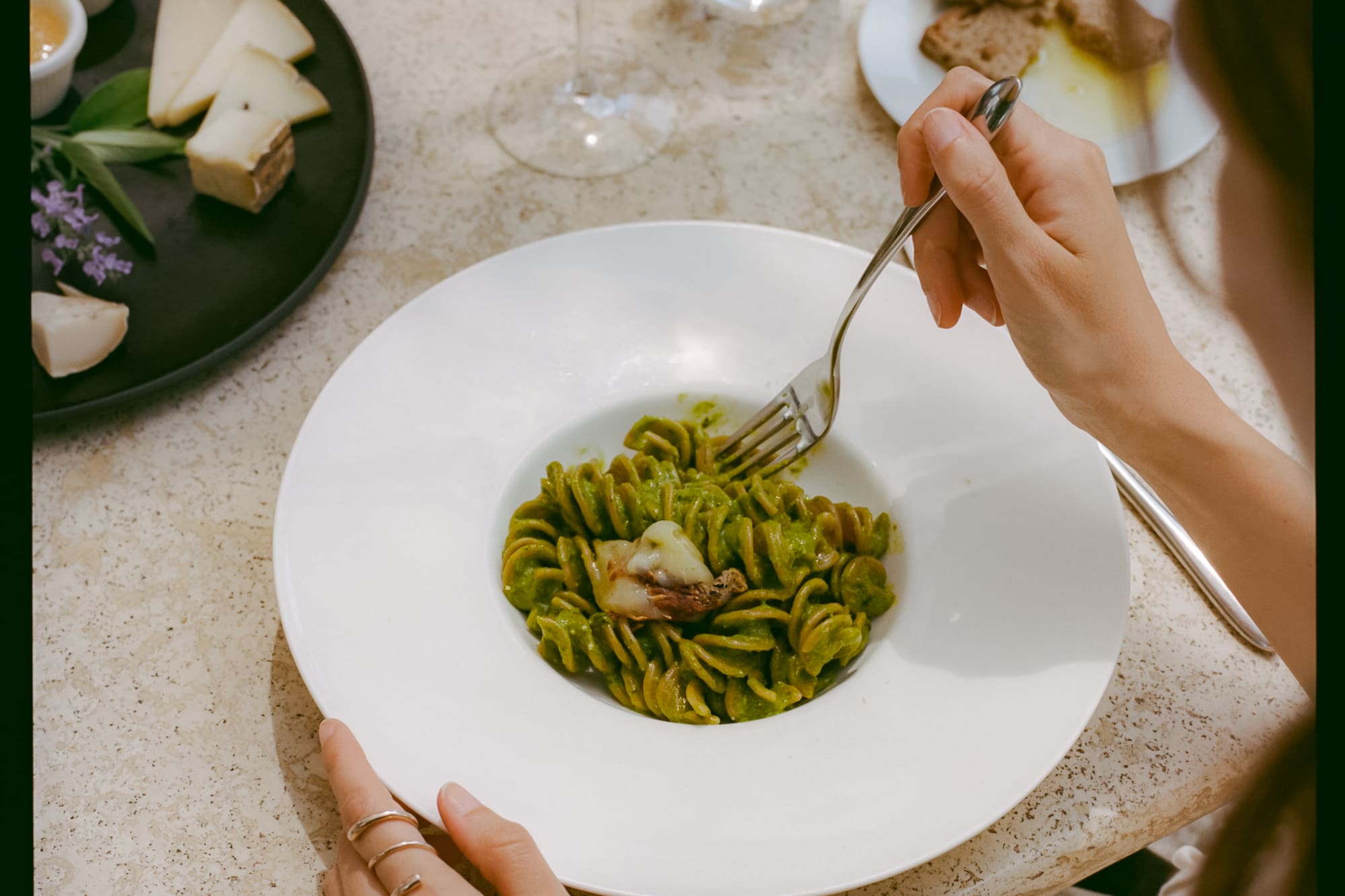 a person eating pasta with a fork