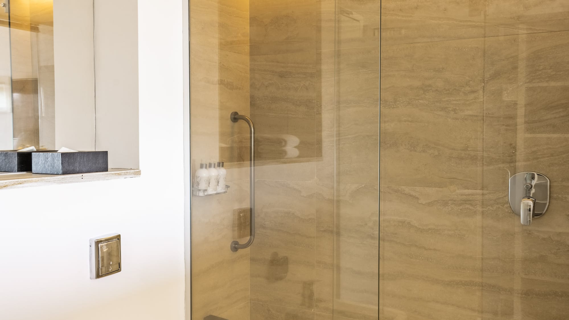 a bathroom with a shower and toilet