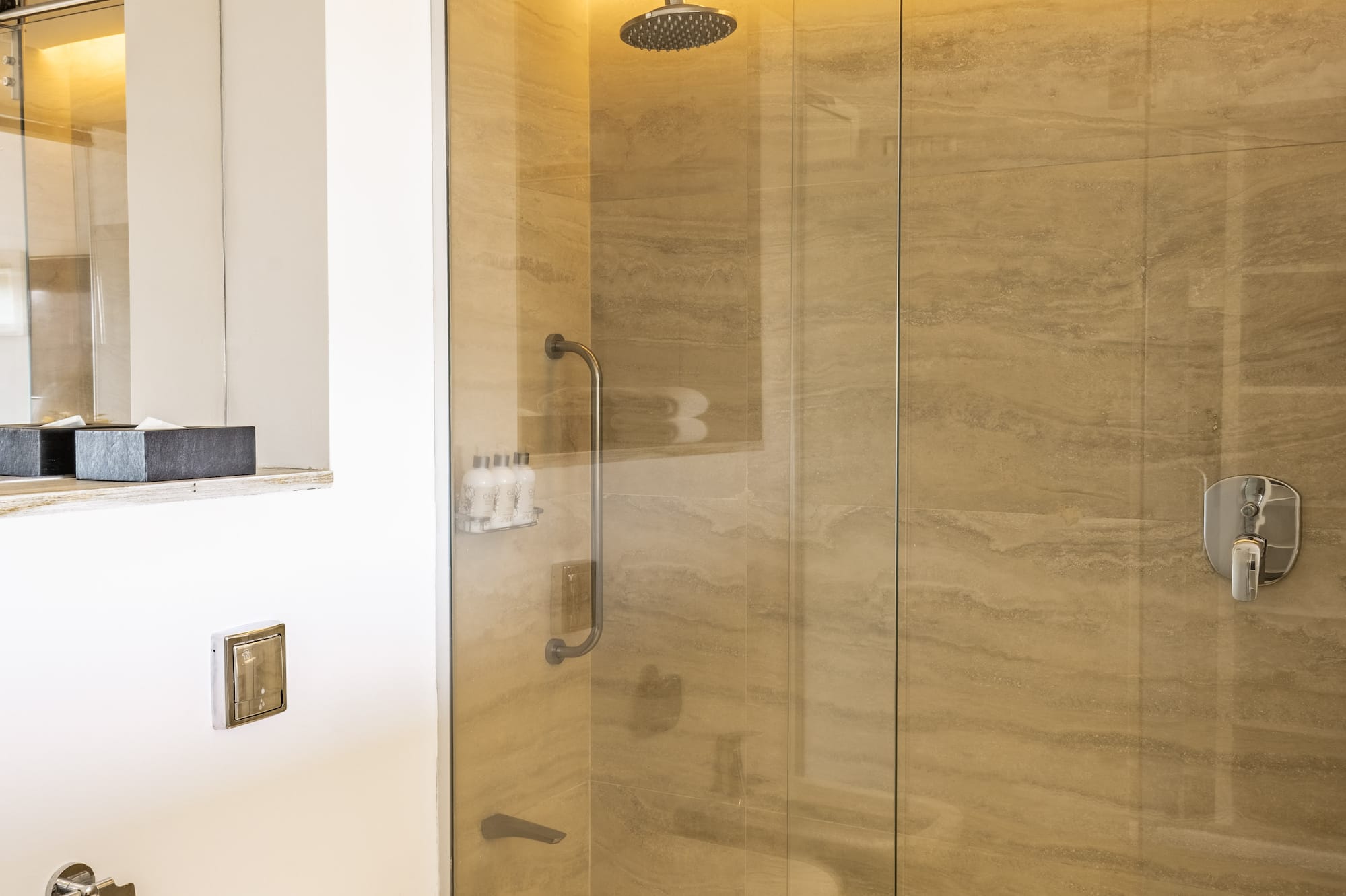 a bathroom with a shower and toilet