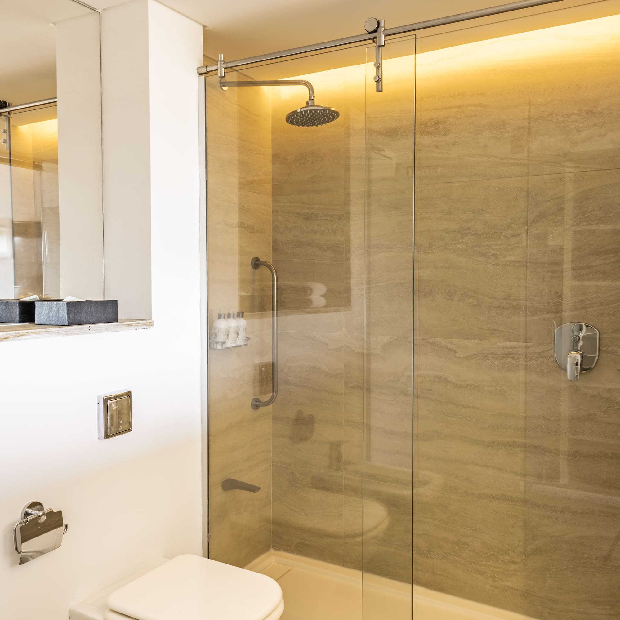 a bathroom with a shower and toilet