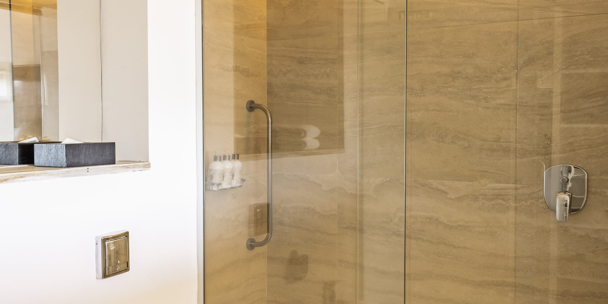 a bathroom with a shower and toilet