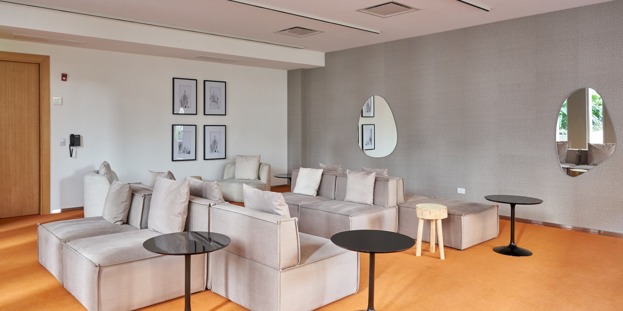 a room with couches and tables