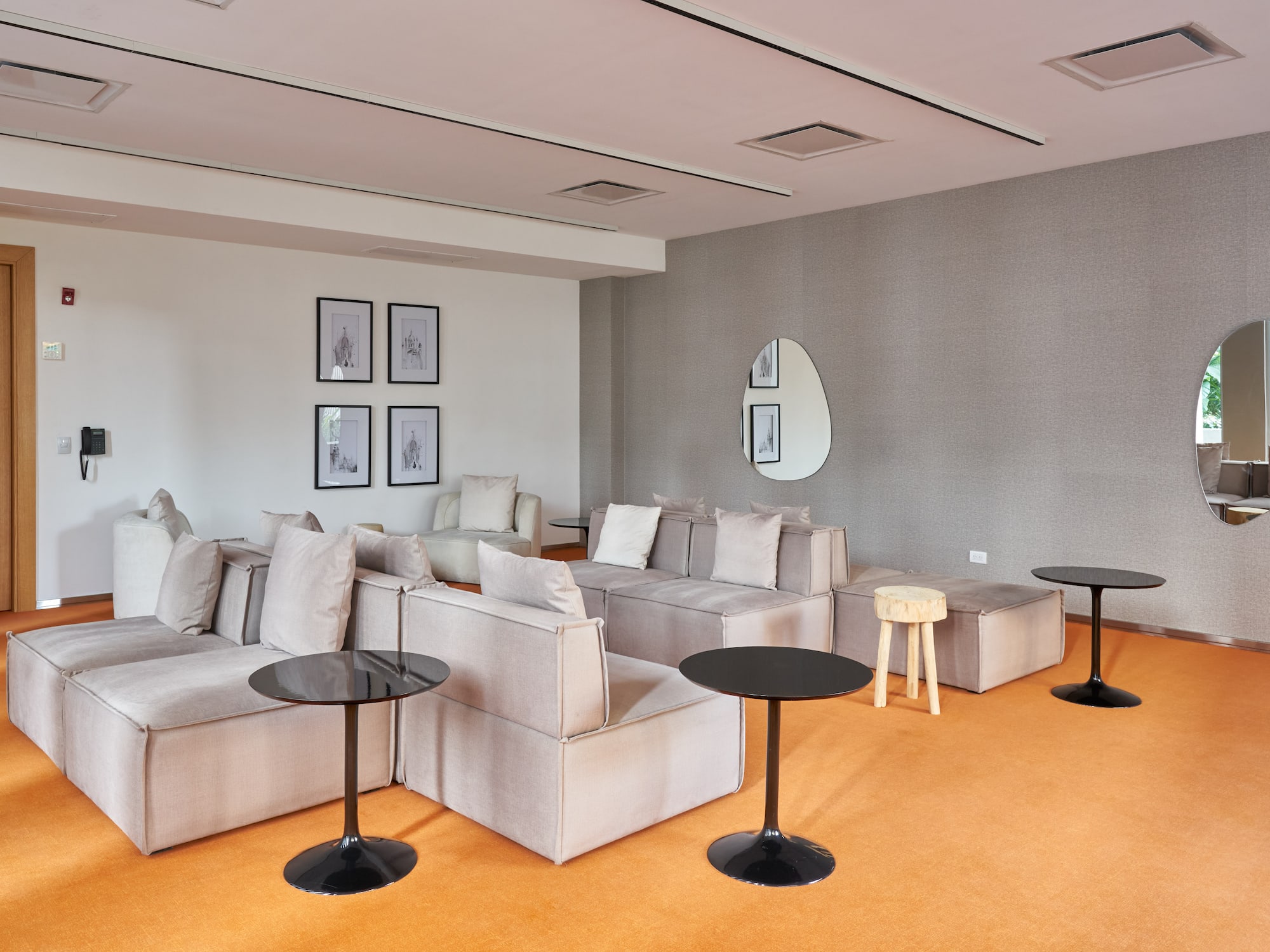 a room with couches and tables.