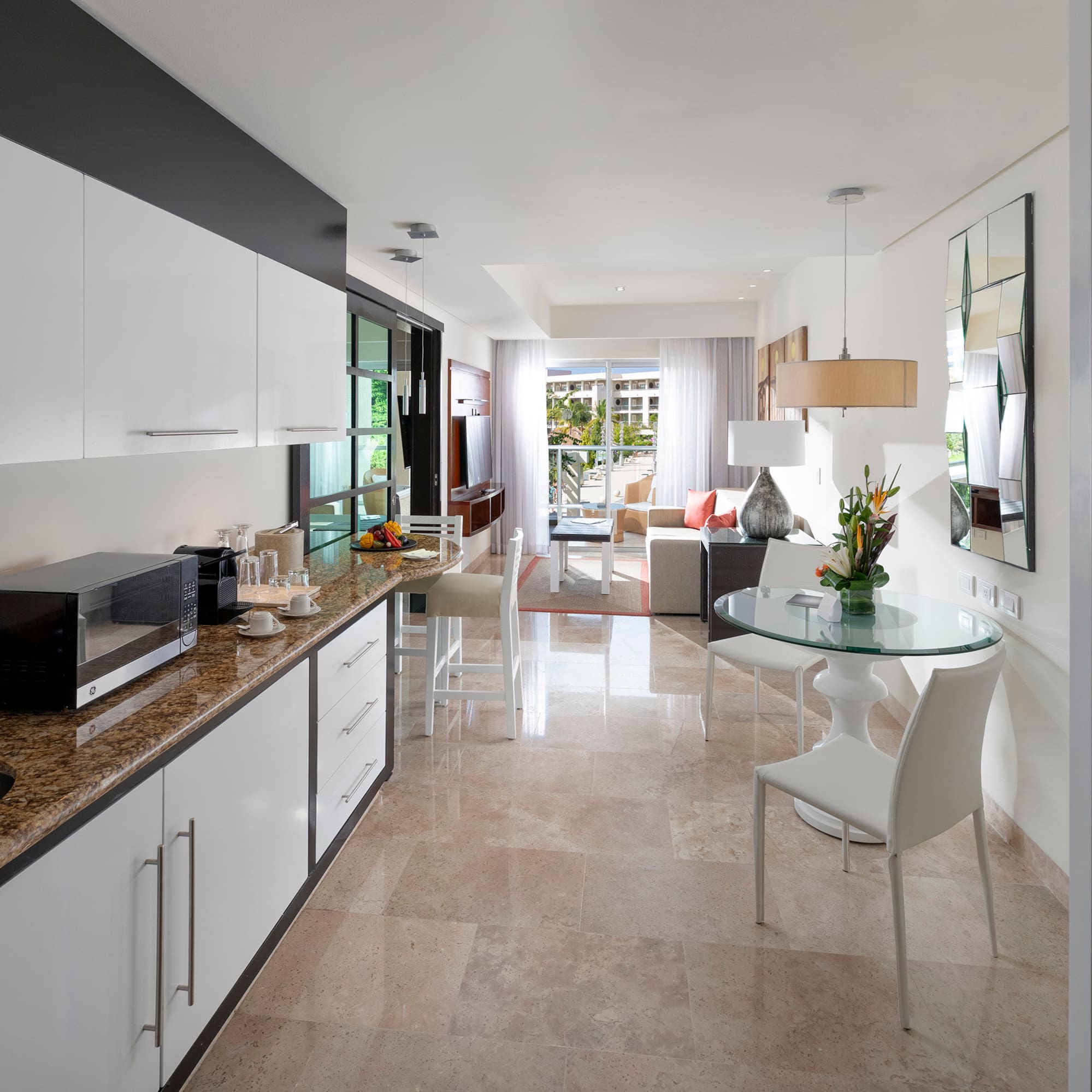 a kitchen with a table and chairs