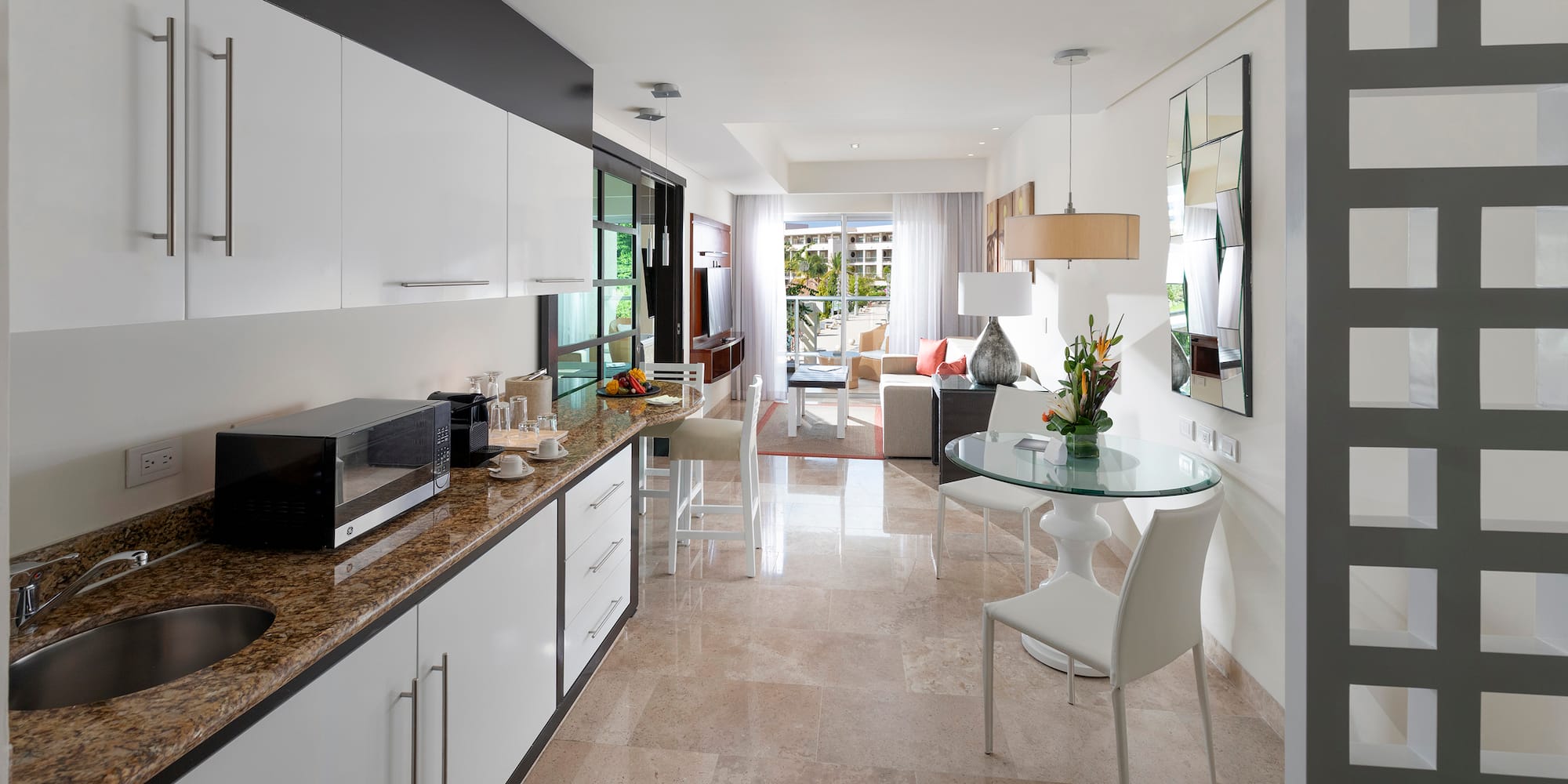 a kitchen with a table and chairs