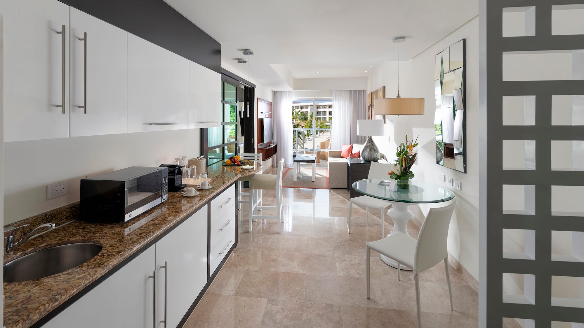 a kitchen with a table and chairs