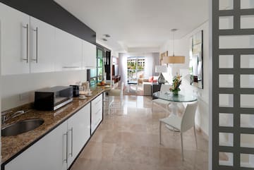 a kitchen with a table and chairs
