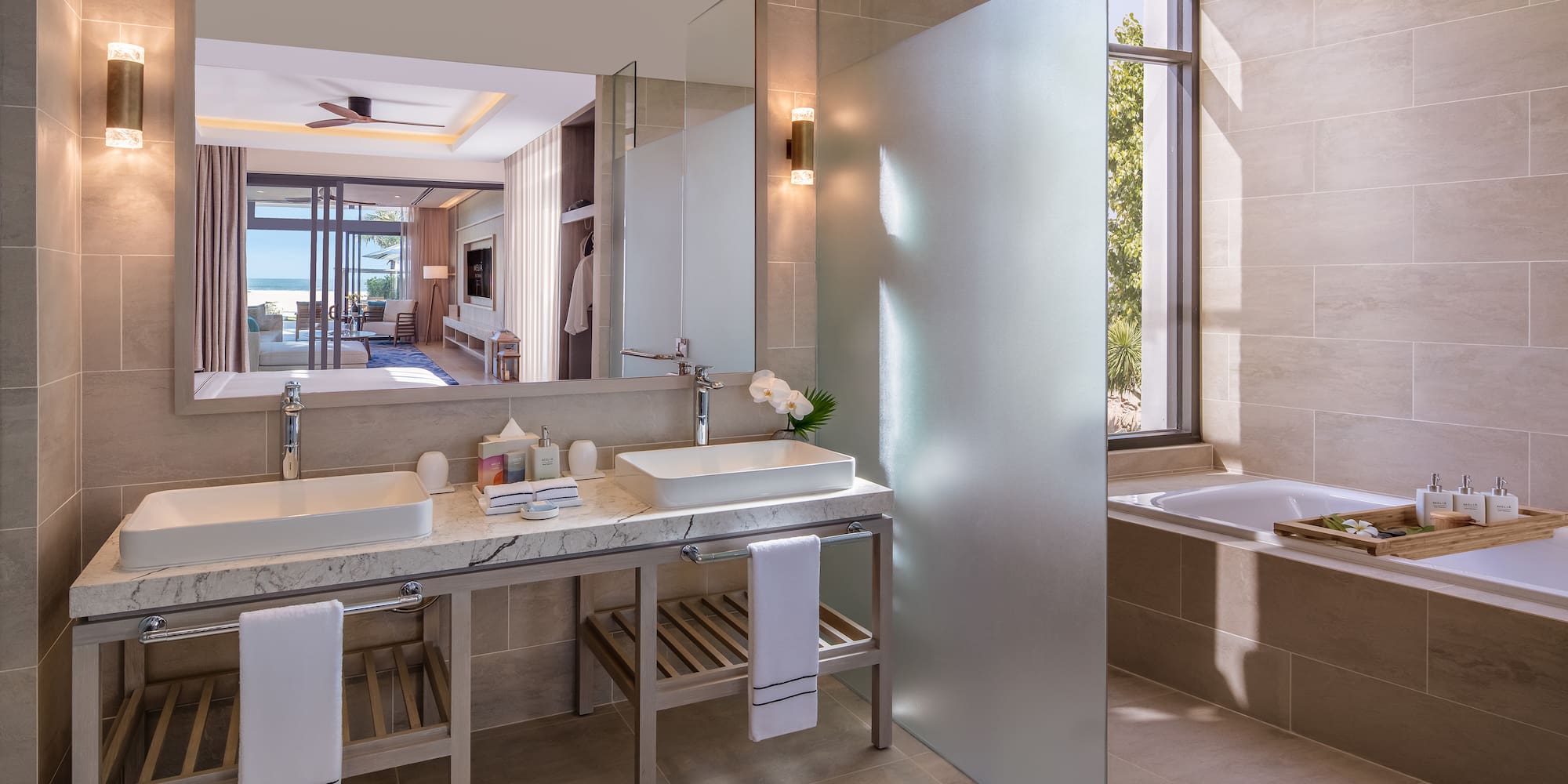 a bathroom with a large mirror and sink