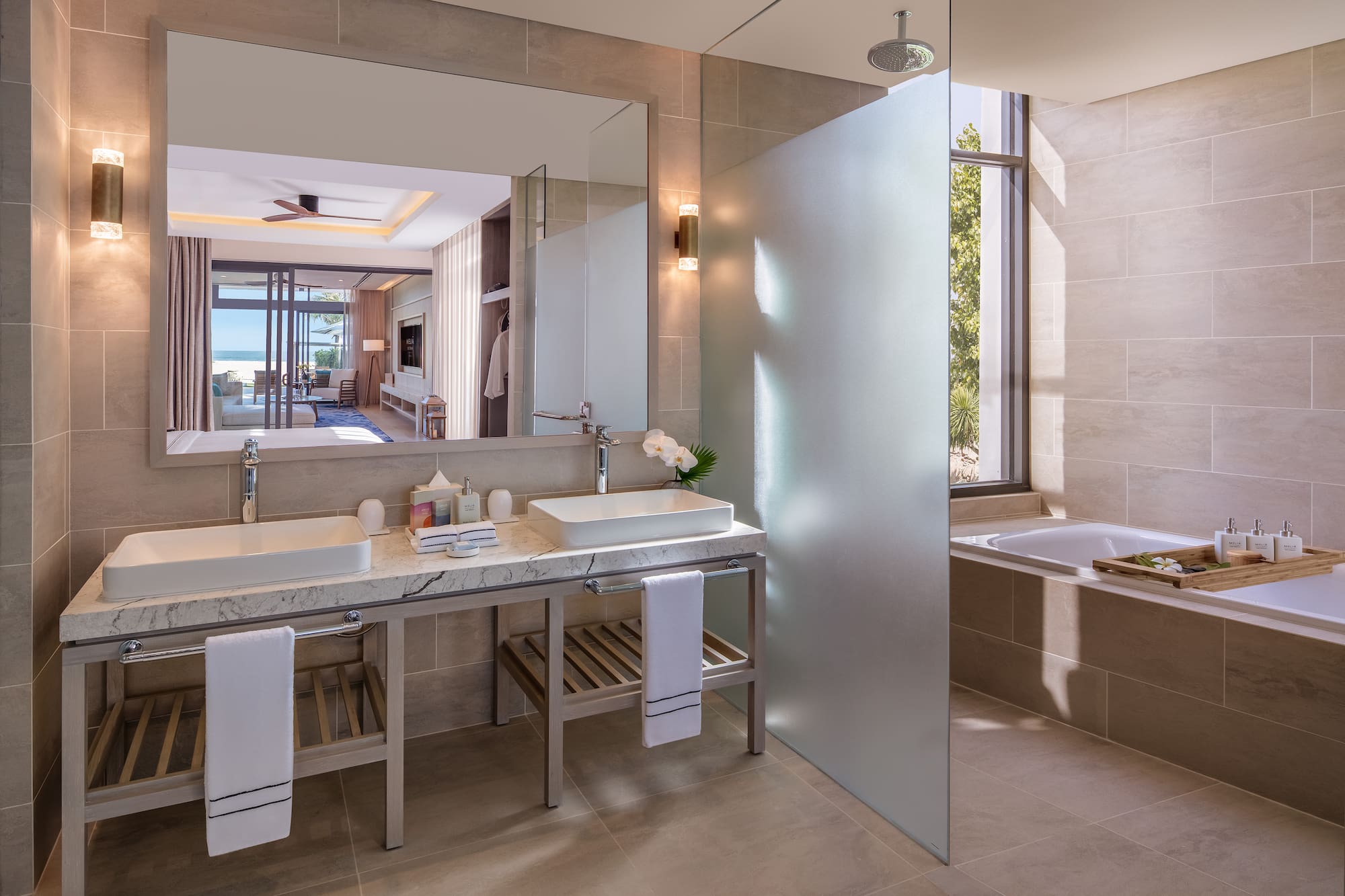 a bathroom with a large mirror and sink
