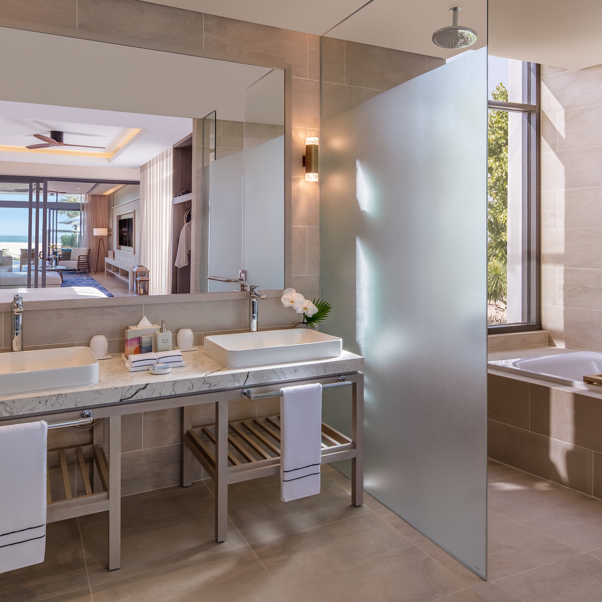 a bathroom with a large mirror and sink