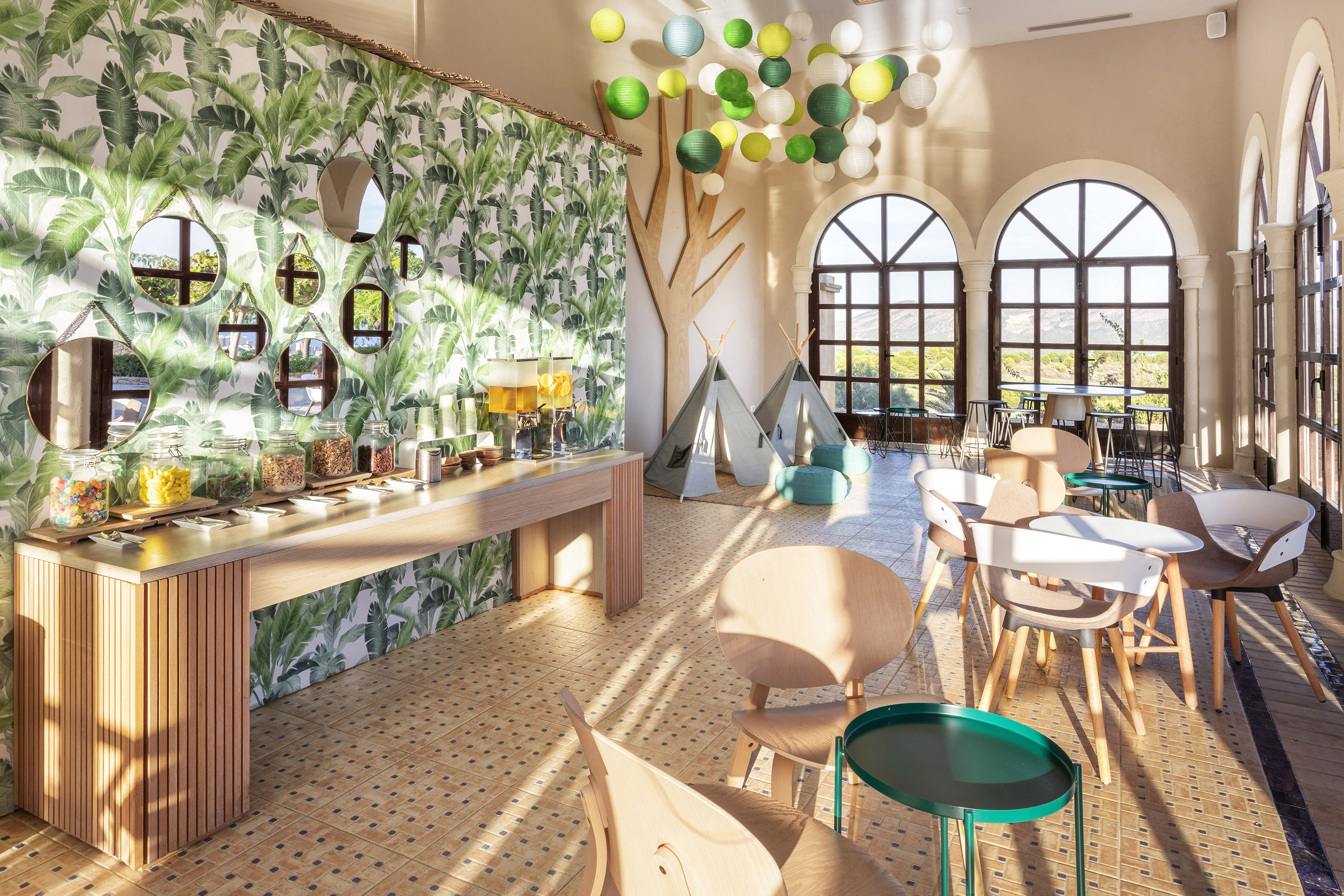 a room with tables and chairs and a tent