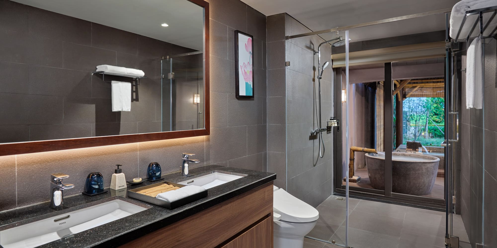 a bathroom with a large mirror and a tub