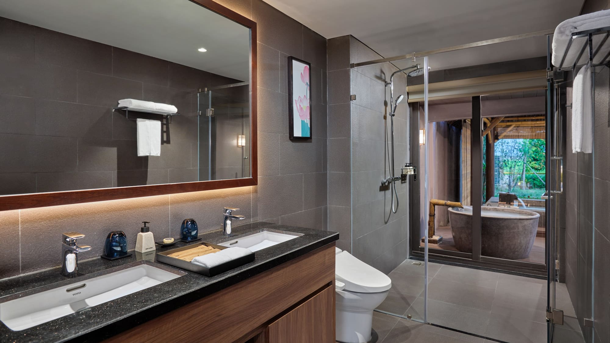 a bathroom with a large mirror and a tub