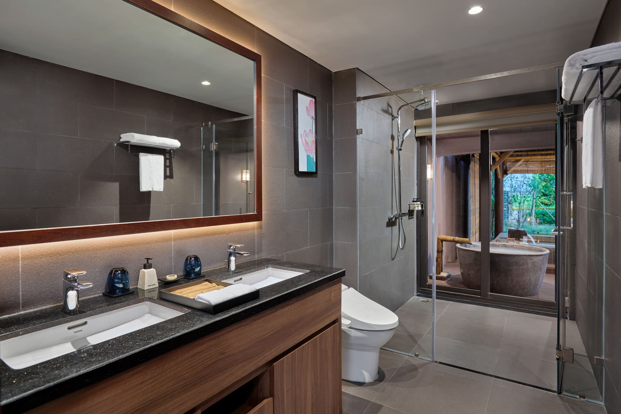 a bathroom with a large mirror and a tub