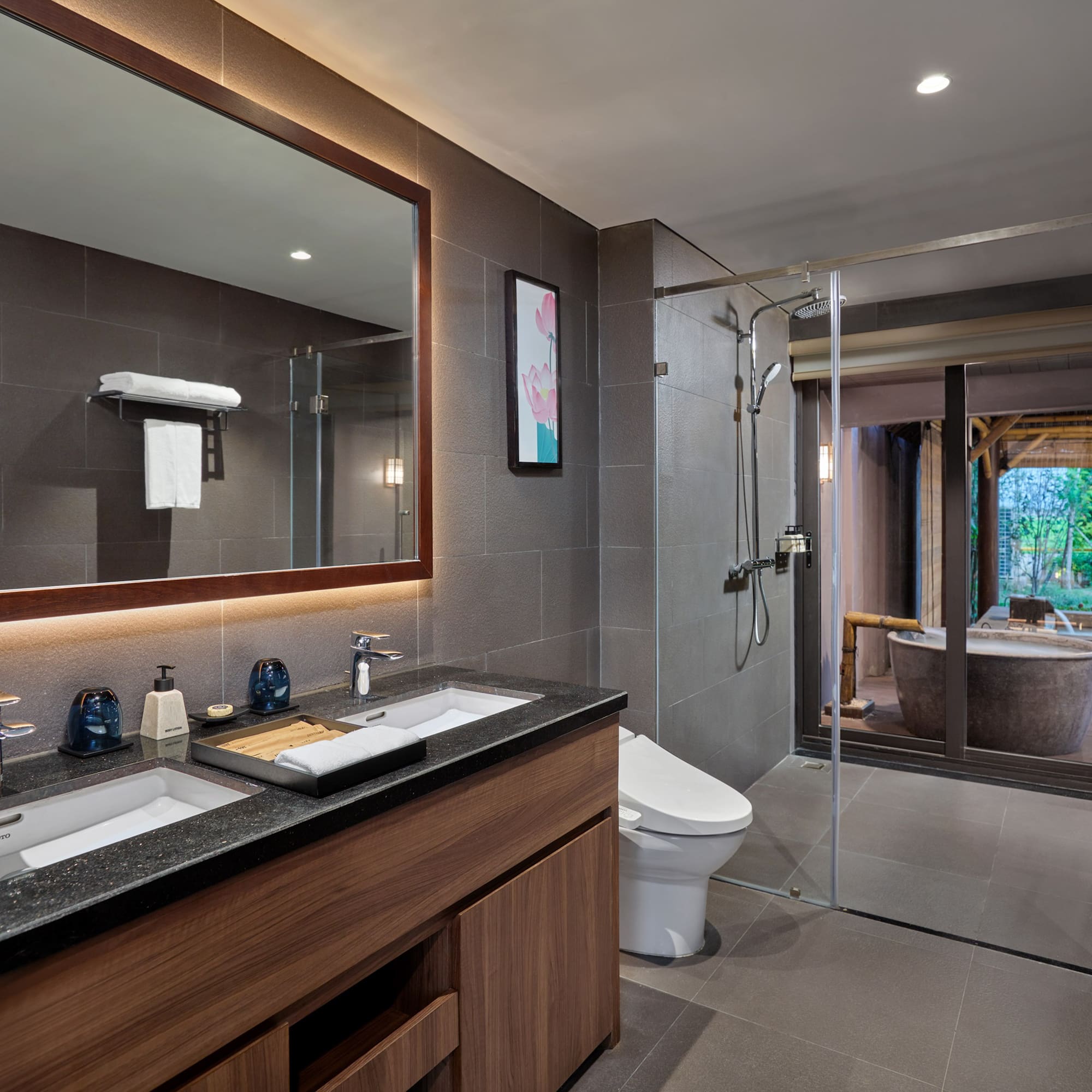 a bathroom with a large mirror and a tub