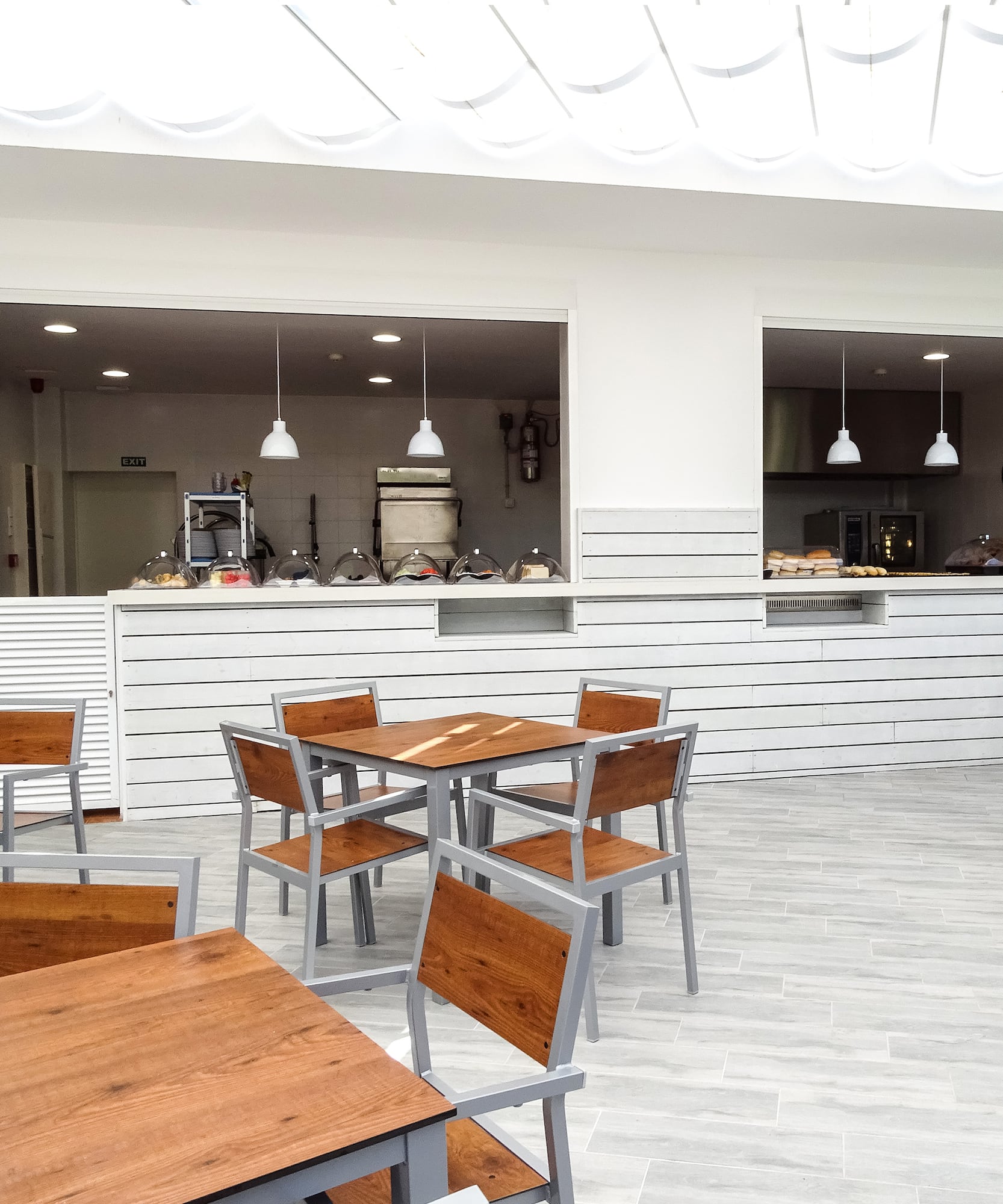 a restaurant with tables and chairs