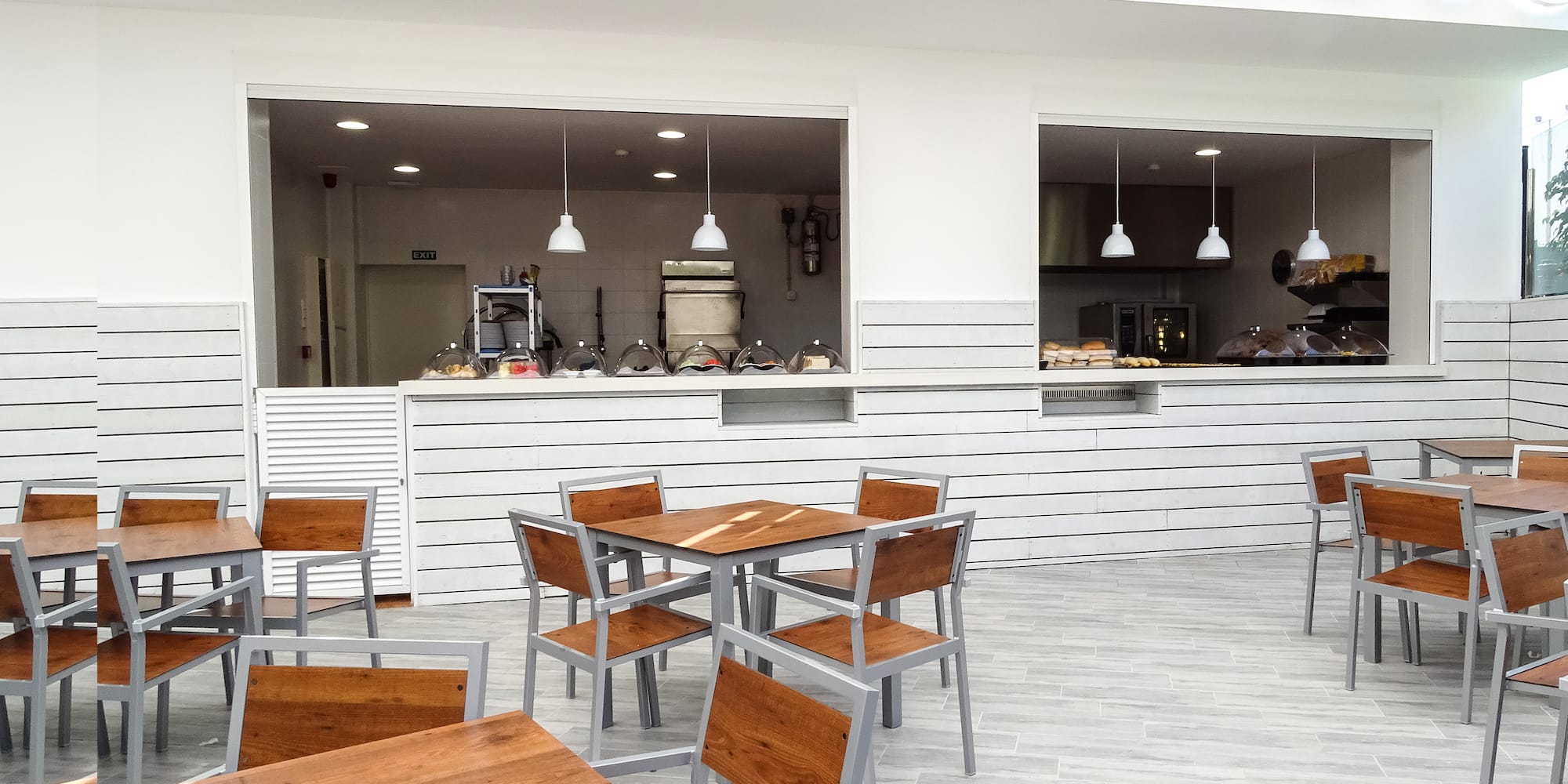 a restaurant with tables and chairs