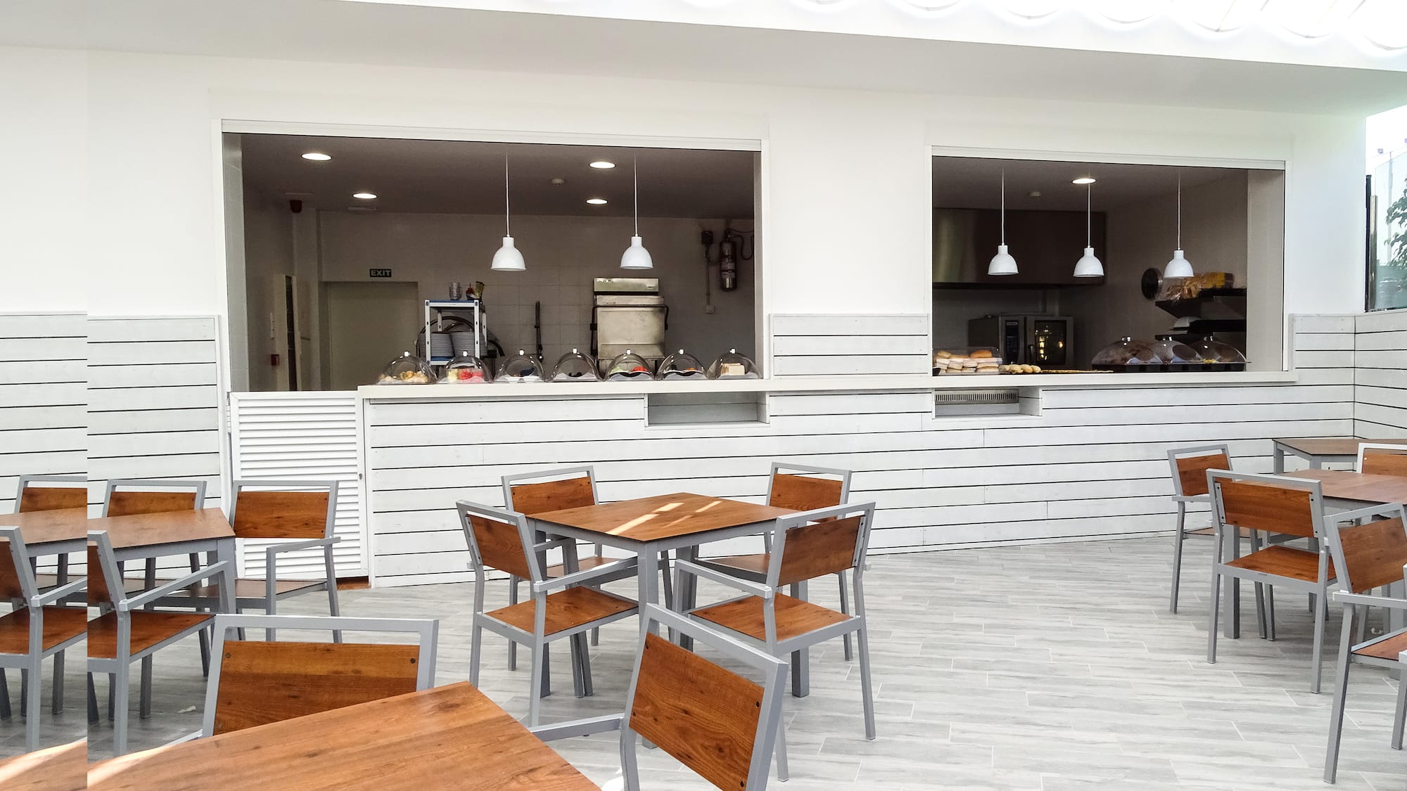 a restaurant with tables and chairs