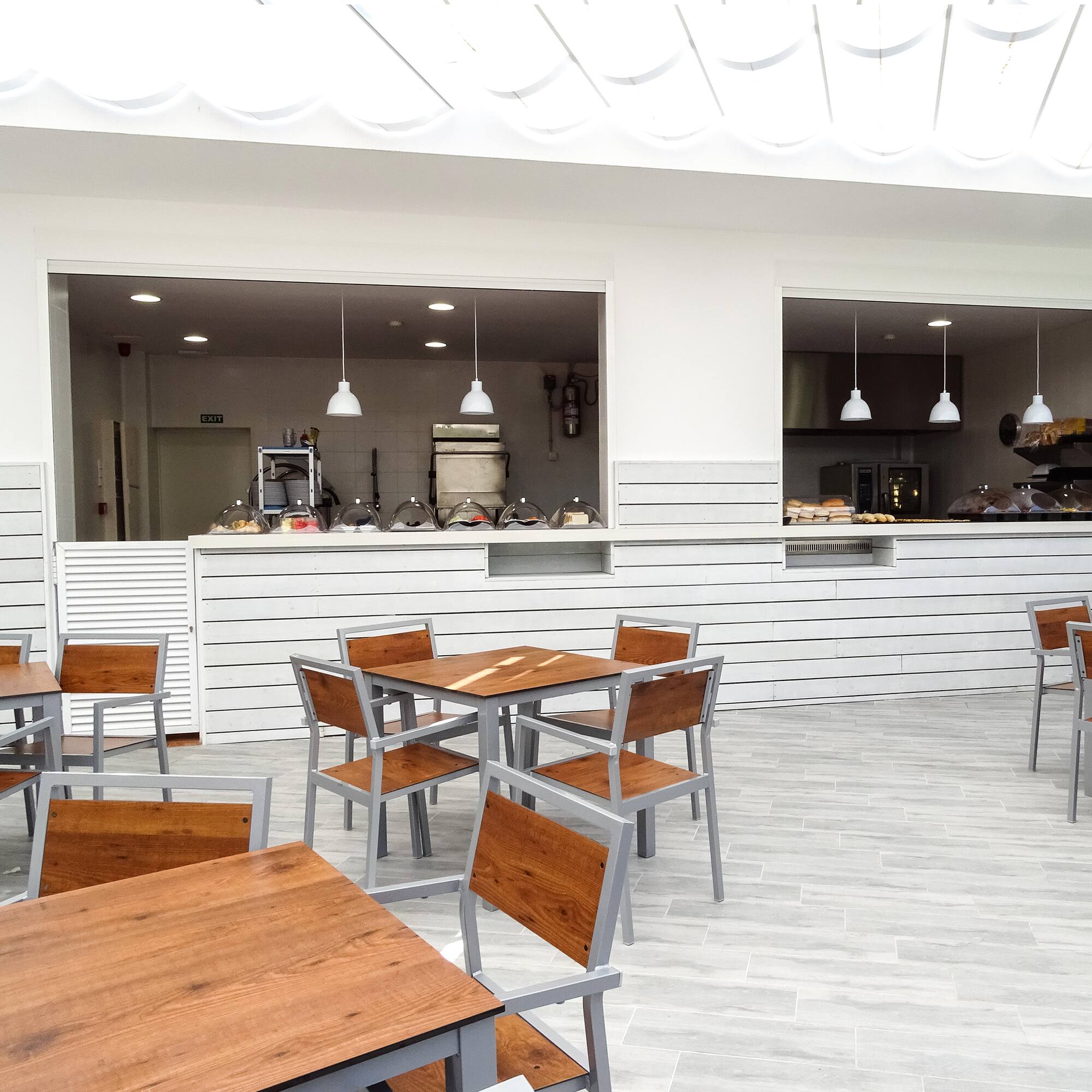 a restaurant with tables and chairs