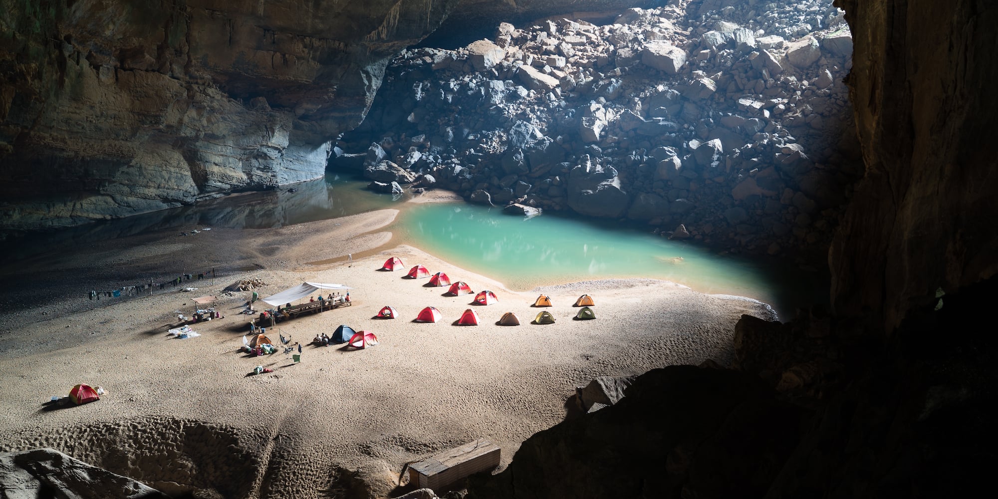 a group of tents on a beach