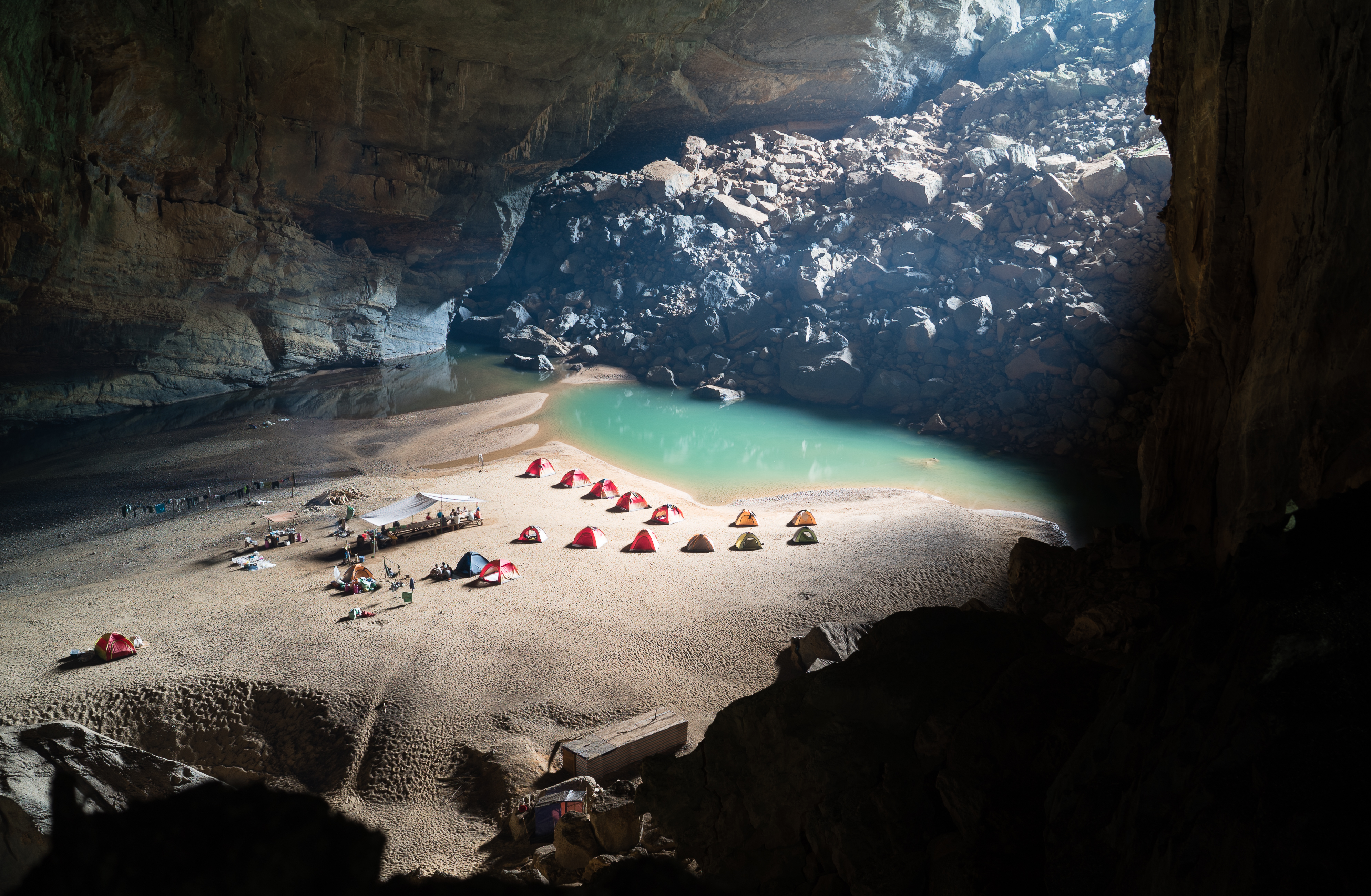 a group of tents on a beach