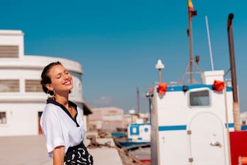 a woman sitting on a ledge