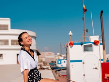a woman sitting on a ledge