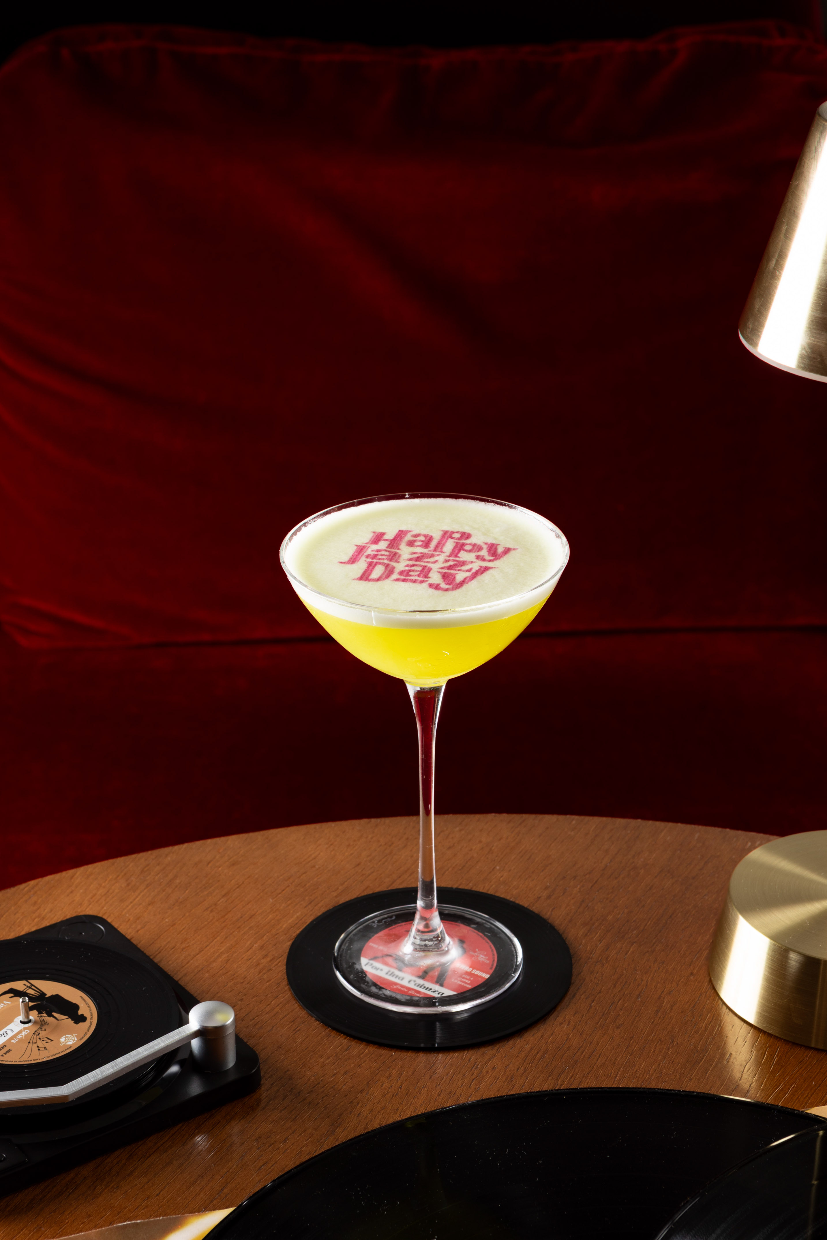 Happy Jazz Day yellow cocktail, martini glass, vinyl coaster, record player.