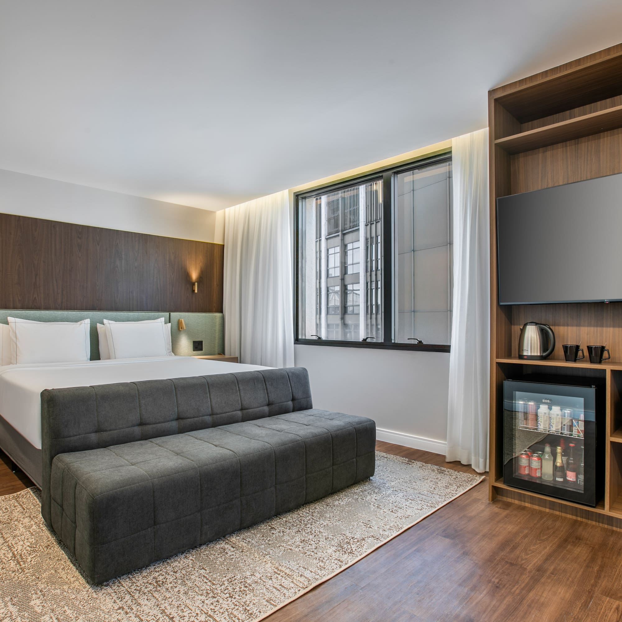 a room with a bed and a tv