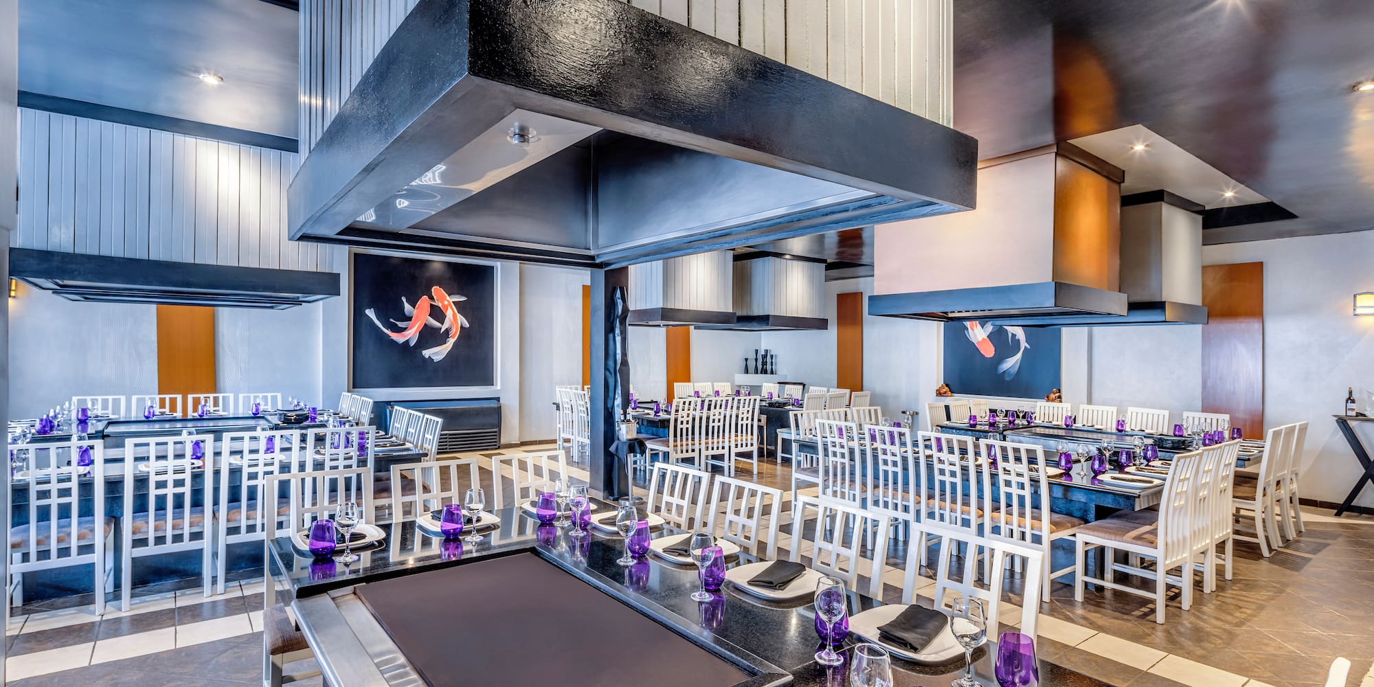 a restaurant with tables and chairs