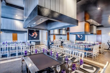 a restaurant with tables and chairs