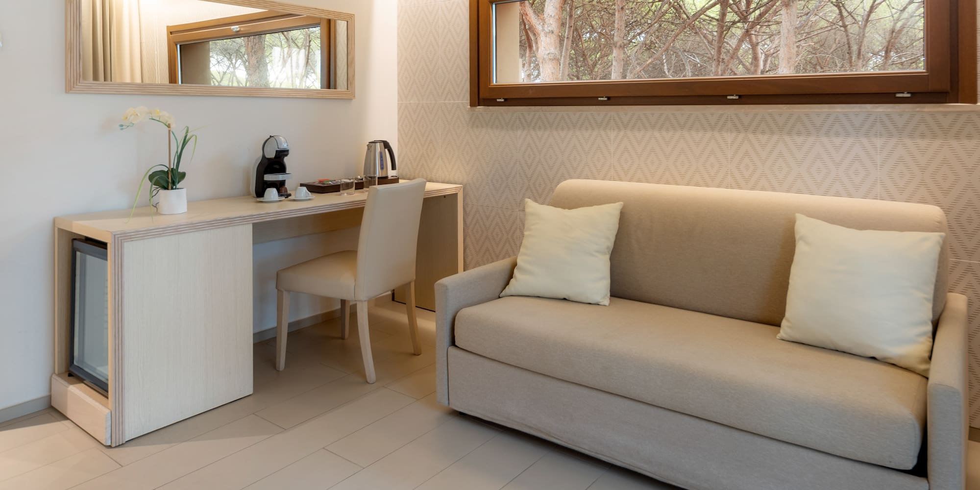 a room with a couch and a desk