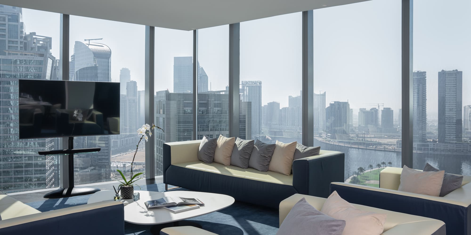 a living room with a view of a city