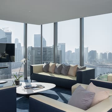 a living room with a view of a city