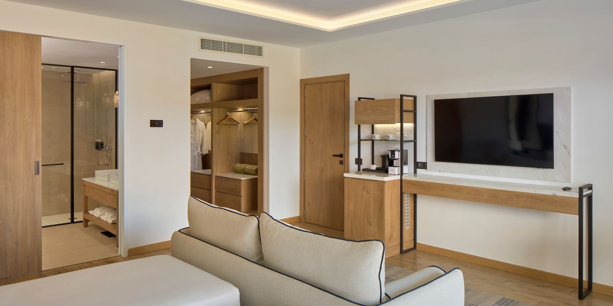 a room with a tv and couch