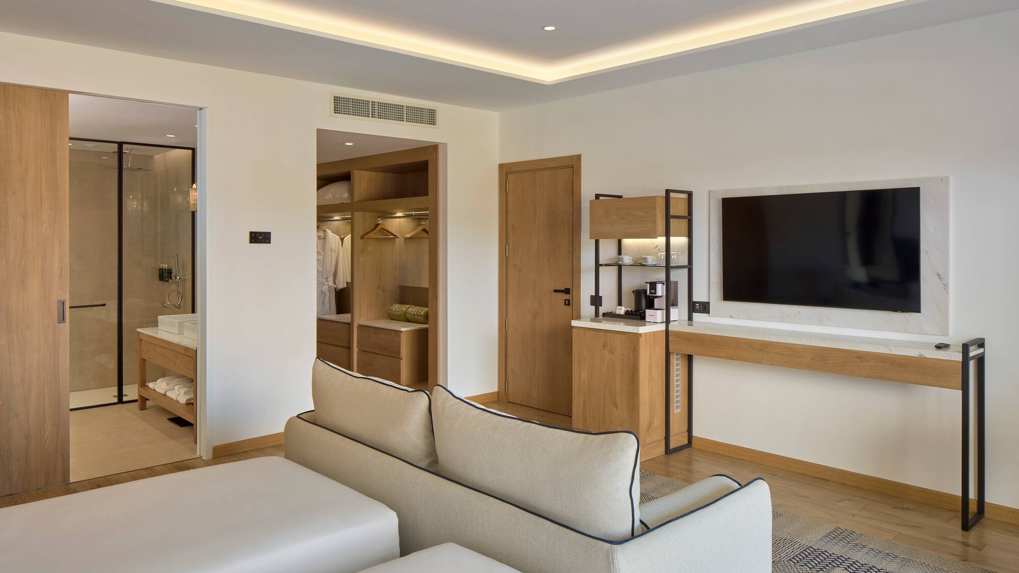 a room with a tv and couch