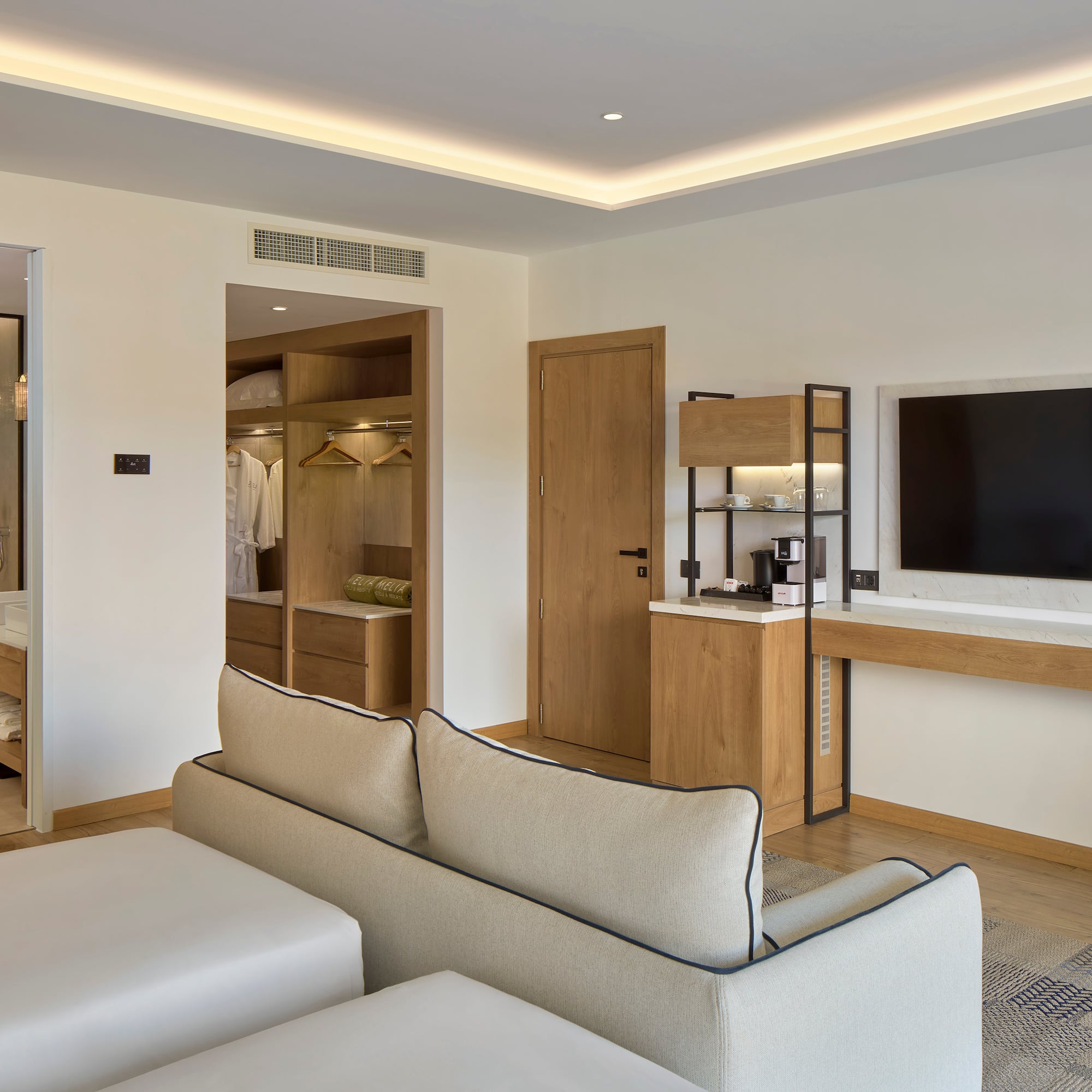 a room with a tv and couch