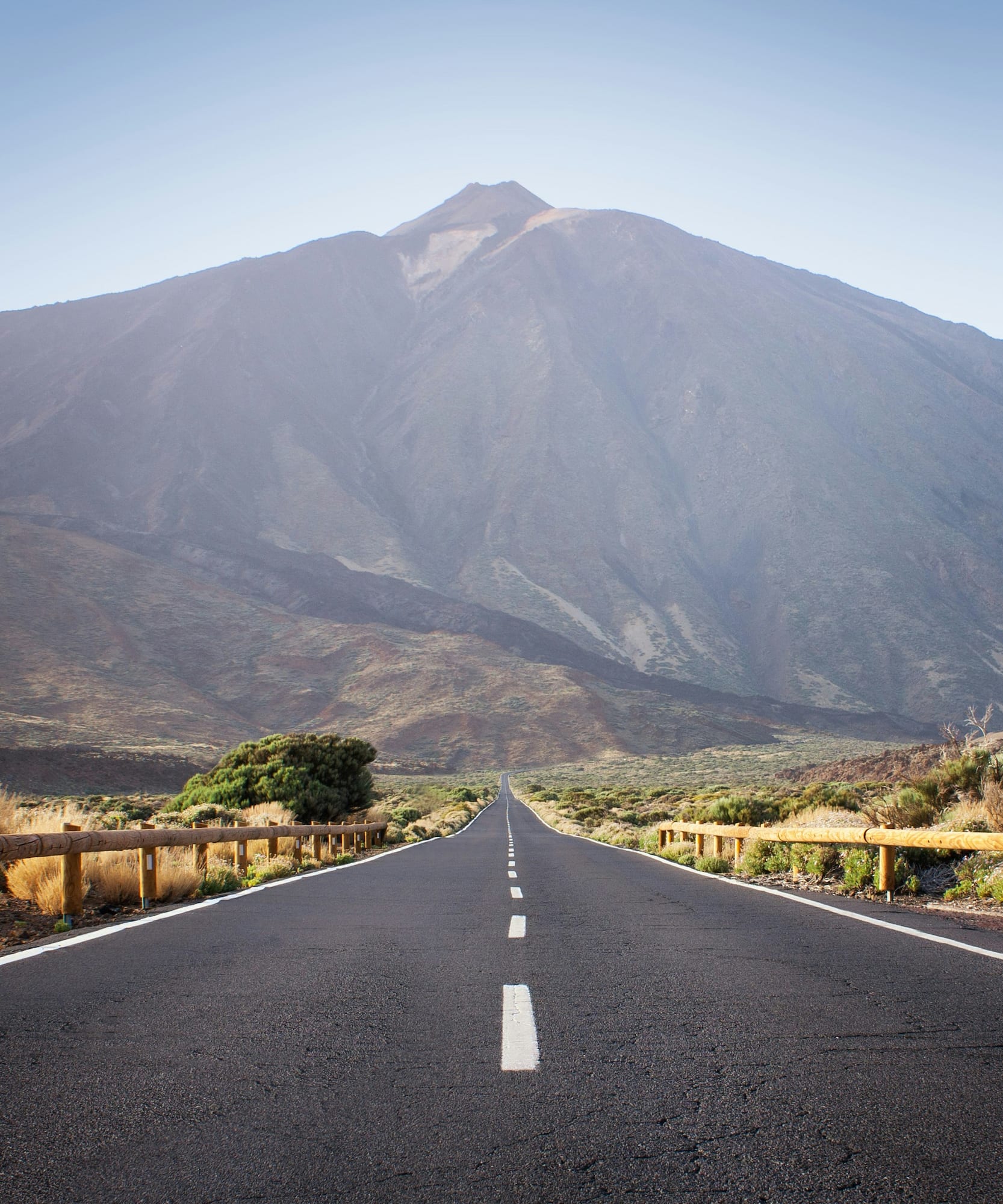 Long straight road leading to Mount Teide volcano, Tenerife.